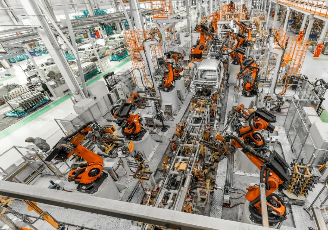 Welding machines in an automobile production plant, top view. Predictive maintenance is crucial in any factory.
